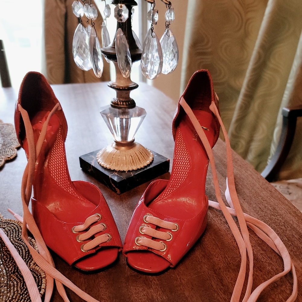 Used a couple of times Nine West wrap red heels, size 7M